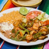 Fajitas de Camaron · Shrimp cooked with sliced onions, sliced green peppers and tomatoes.