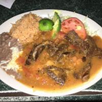Wednesday Special with free flavored water · Ribeye steak in hot sauce
Lomo en Chile de Árbol