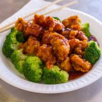 SS9. General Tso's Chicken · Deep fried chunks of boneless chicken again stir-fried in a hot chili brown sauce. With whit...