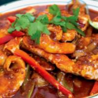 56. Spicy Seafood a la Carte + White Rice (dry) · Crab, shrimp, calamari, mussels and fish fillets in a chili garlic sauce.