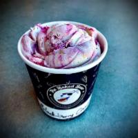 Blackberry Crumble Pint · Vanilla bean ice cream with blackberry ripple and pie crust pieces.