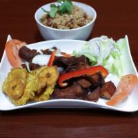 Fried Pork · Served with rice and beans, fried plantain and salad.