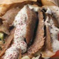 Classic Gyro Sandwich · Thinly sliced beef and lamb topped with lettuce, tomato, onion and cucumber sauce wrapped in...