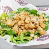 Chicken Caesar Salad · Fresh Romaine lettuce with Parmesan cheese and croutons topped with chicken tenders. Served ...