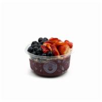 Pura Vida Acai Bowl · Acai bowl blended with pure acai topped with granola, blueberry, strawberry & honey.