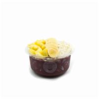 Tropical Acai Bowl · Acai bowl blended with pure acai topped with granola, banana, pineapple, coconut flakes & ho...