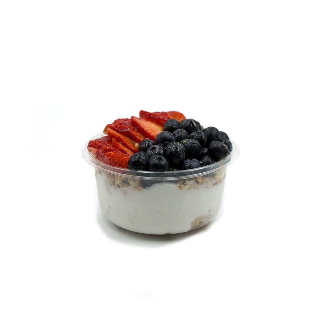 Coco Berry Bowl · Topped with granola, blueberry, strawberry and honey.  Made with raw coconut, banana and coconut milk.