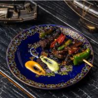 Mushroom Yakitori · Grilled juicy portabella mushrooms with green and red onion skewered and based in our specia...