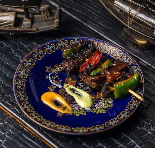 Mushroom Yakitori · Grilled juicy portabella mushrooms with green and red onion skewered and based in our special sauce.