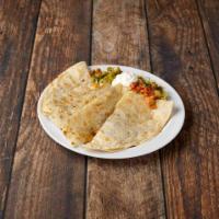 Super Quesadilla · Choice of meat and cheese, lettuce, guacamole and sour cream on the side.