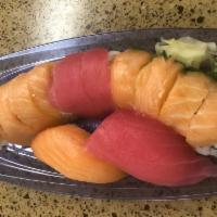 Rainbow Roll Special · 10 pieces plus 2 California roll (10 pieces) Topped with salmon and tuna. Comes with 2 addit...