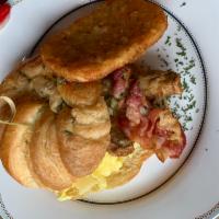 Americano croissant  · Three scrambled eggs, croissant, cheese,bacon,sausages, hash brown 
