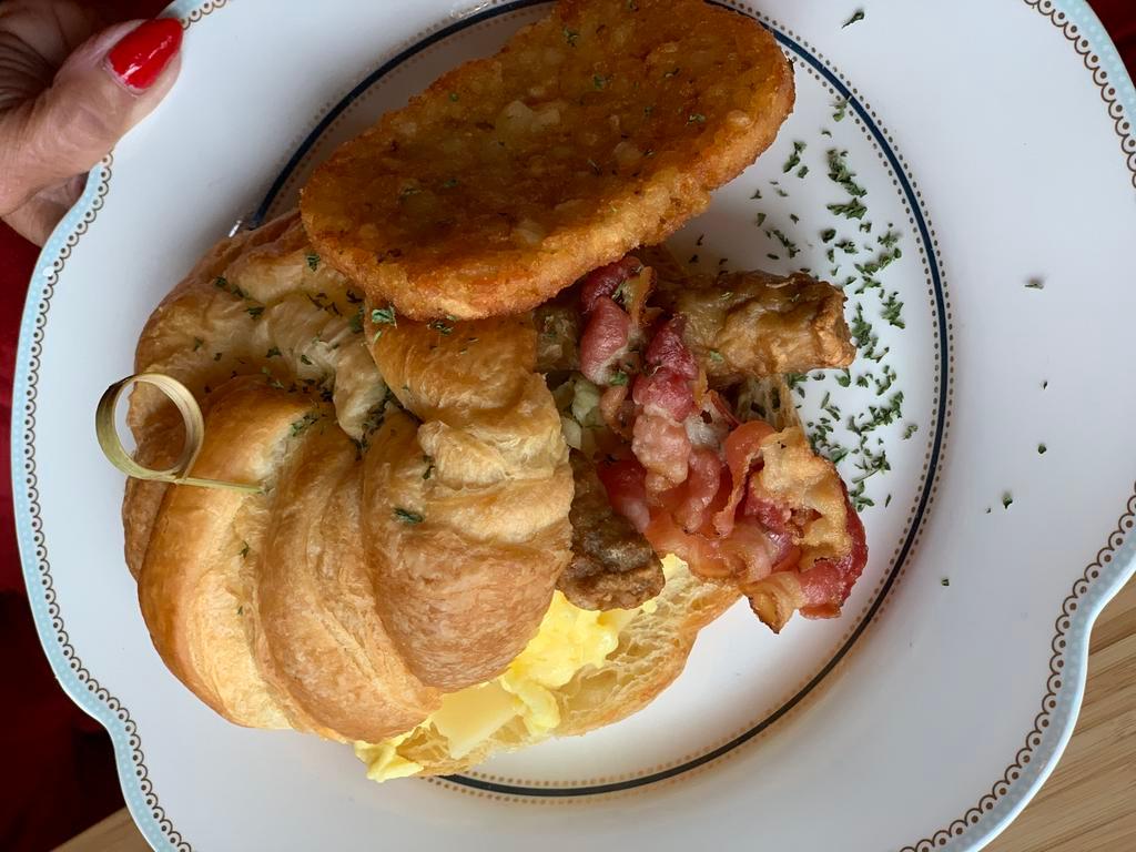 Americano croissant  · Three scrambled eggs, croissant, cheese,bacon,sausages, hash brown 
