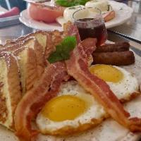 French toast · Six thick French toast, 2 sunny side up eggs, bacon strips, sausages and syrup