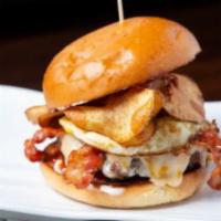 Hangover Burger · Battered thinly sliced potato, crisp bacon, Swiss, and cheddar, fried egg and pickles with k...