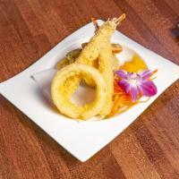 Shrimp Tempura Roll · Shrimp tempura, spring mix, cucumber and masago, served with eel sauce.