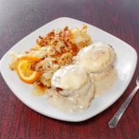 Country Benedict · Poached fresh eggs on top of the biscuit with sausage patties and homemade sausage gravy.