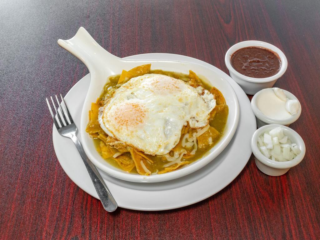 Chilaquiles · Now serving homemade tortilla chips covered in a delicious green or red salsa topped with mozzarella cheese and 2 eggs any style on top. Side black beans, sour cream and onion.