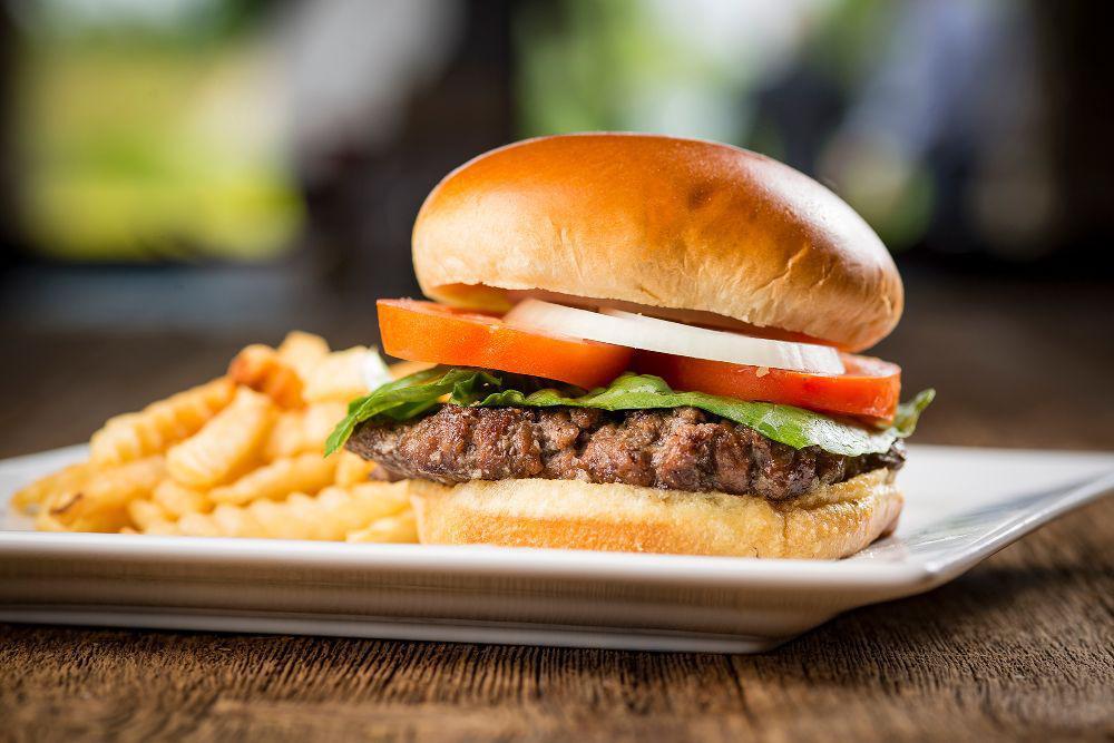 Burger · 1/2 lb. ground beef patty with lettuce, tomato and onion bringing you the ultimate in tenderness, juiciness and flavor, served with french fries or side salad.