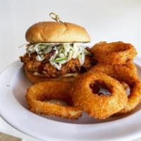 Nashville Hot Chicken Sandwich · Chicken breast smothered in Nashville Hot sauce, lettuce, tomato, pickles, house sauce and m...