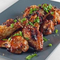 6 Piece Bone-in Wings · 6 piece bone in wings deep fried and covered in a sauce of your choosing. Includes ranch or ...