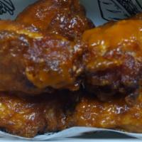 10 Piece of Bone-In Wings · 10 Piece bone-in wing deep fried and covered in a sauce of your choosing. Includes ranch or ...
