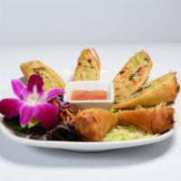 Veggie Egg Roll · Egg rolls stuffed with mixed vegetables and deep fried. Served with sweet and sour sauce.