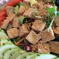 House Salad · Romaine, lettuce, onions, tomato, tofu, carrots, and cucumbers. Topped with tasty peanuts an...