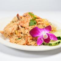 Pineapple Fried Rice · Fried rice with prawns, chickens, pineapple, and cashew nuts.