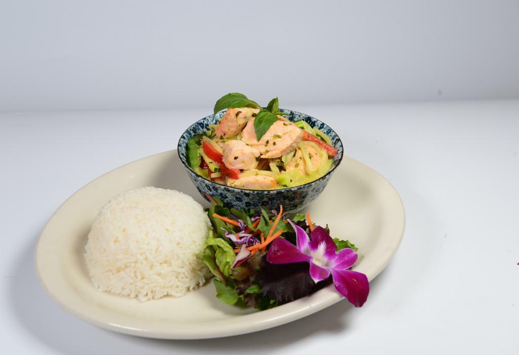 Salmon Green Curry · Poached salmon fillet with green curry, coconut milk, green and red bell peppers, bamboo shoots, zucchini, and basil. Served with rice.