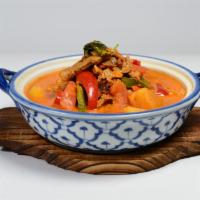 Red Curry Duck · Roast duck in red curry with coconut milk, tomatoes pineapples, bell peppers, and basil.
