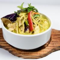 Green Curry · Spicy green curry with coconut milk, bamboo shoots, zucchini, sweet basil, eggplant, and gre...