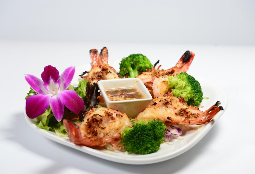 Garlic & Pepper Prawns · Grilled jumbo prawns topped with butter, garlic, and pepper. Served with a spicy sauce.