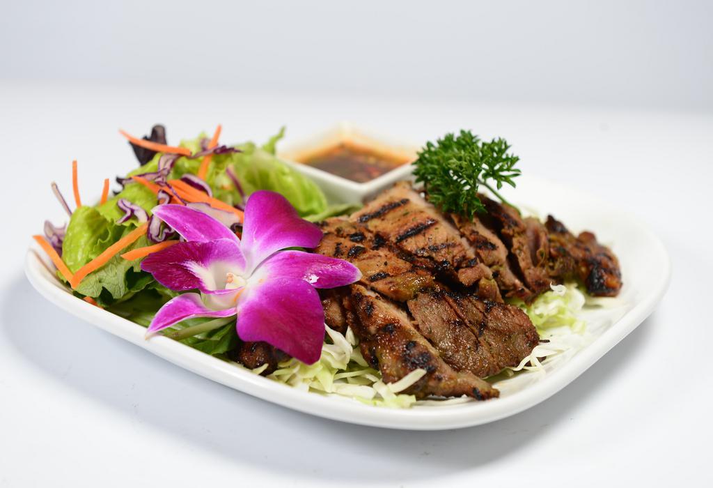 Moo Yang · Pork, marinated, and grilled. Served with sweet chili sauce.