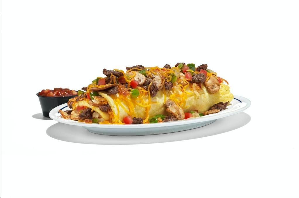 Big Steak Omelette · Steak, hash browns, green peppers, onions, mushrooms, tomatoes & Cheddar. Served with salsa. Served with choice of side.