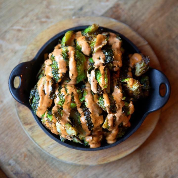 Fried Brussel Sprouts · Gluten friendly dish. Topped with our chipotle remoulade.