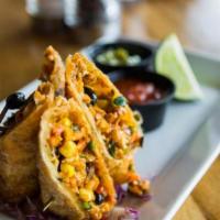 Tex Mex Rolls · Spiced chicken, cheddar cheese, roasted corn, black beans, peppers, onions, and tomatoes. Se...