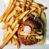 Korean Chicken · Tossed in spicy Gochujang chili sauce with pickled vegetables, on a toasted challah bun