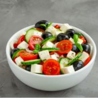 Greek Salad · Fresh salad made with lettuce, tomatoes, cucumbers, red onion, black olives, feta cheese, an...