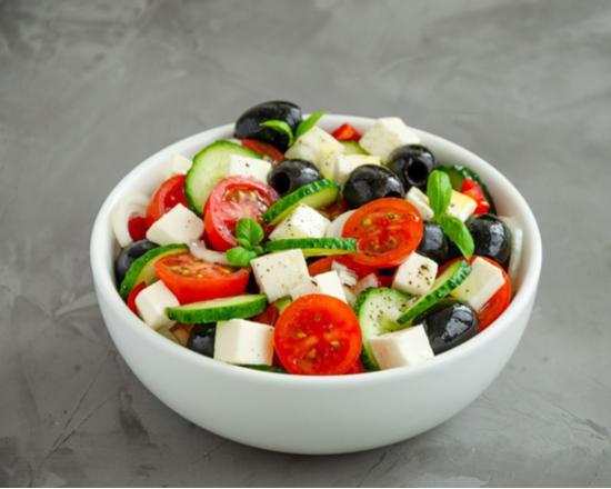 Greek Salad · Fresh salad made with lettuce, tomatoes, cucumbers, red onion, black olives, feta cheese, and a balsamic vinaigrette dressing.