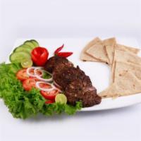 Chabli Kabob Plate · Fresh ground beef kabob plate with steamed rice, salad, hummus and side of pita bread.