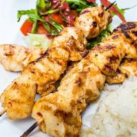 Chili Chicken Kabob Plate · Fresh chicken kabob marinated in chili served with steamed rice, salad, hummus and a side of...