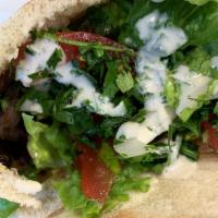 Beef Shawarma Sandwich · Your choice of Pita bread or a sandwich wrap, hummus, cabbage, pickle, parsley/onion, and be...
