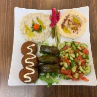 Veggie Plate Combo · Hummus, baba ghanoush, green salad, 3 falafel pieces, 3 grape leaves, and a warm piece of pi...