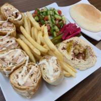 Chicken Shawarma Plate (Arabic) · A Mediterranean wrap filled with Chicken shawarma, cucumber pickles, and garlic spread, gril...