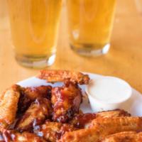 Wings 1/2 lbs · Choice of Buffalo, BBQ or Garlic Parmesan and served with a dipping sauce.
