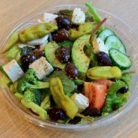 Greek Salad · Mixed salad greens, crumbled feta cheese, red onions, cucumbers, olives, tomatoes, and peppe...