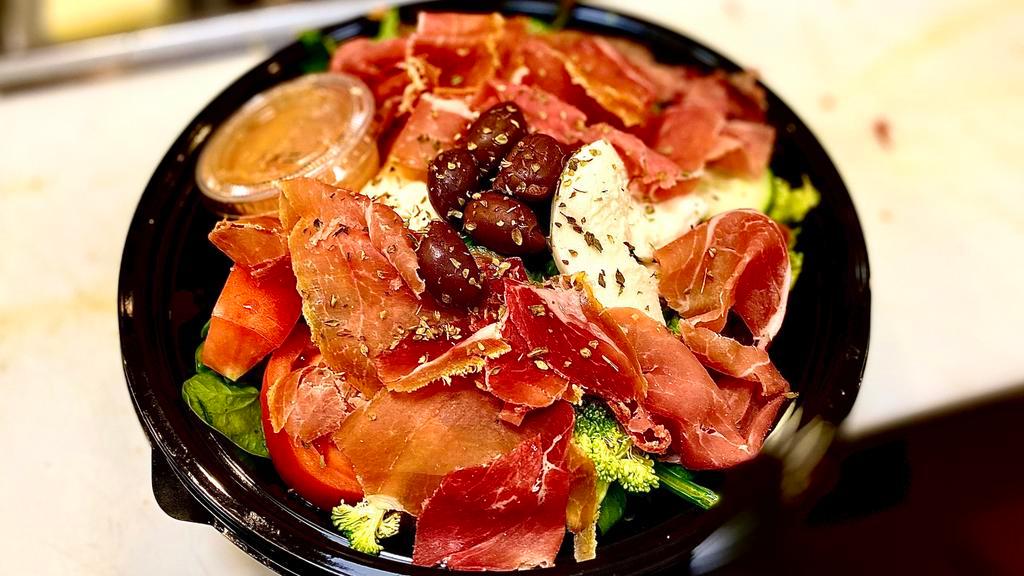 Antipasto Salad · Prosciutto and fresh mozzarella served over a tossed salad with marinated olives. Served with a roll.