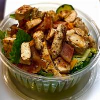Chicken Club Salad · Crispy romaine lettuce, bacon, grilled chicken breast, cheddar, and tomatoes. Served with a ...