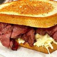 New Yorker · Pastrami, Swiss cheese, and coleslaw on grilled rye.